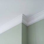 Ceiling moldings in the interior, a detail of intricate corner.